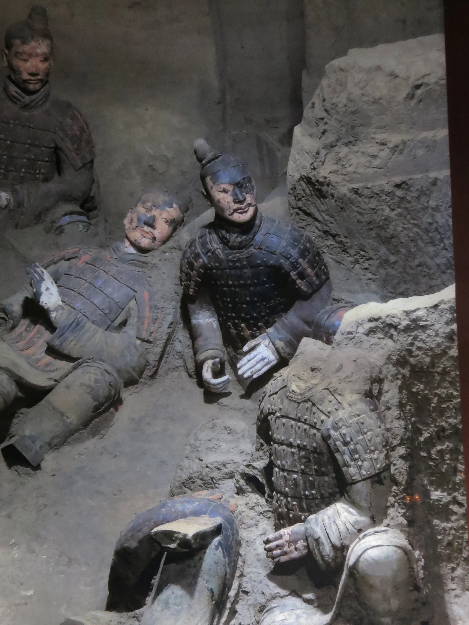 Restored pigment traces on excavated terracotta warriors, showing how the figures originally appeared.