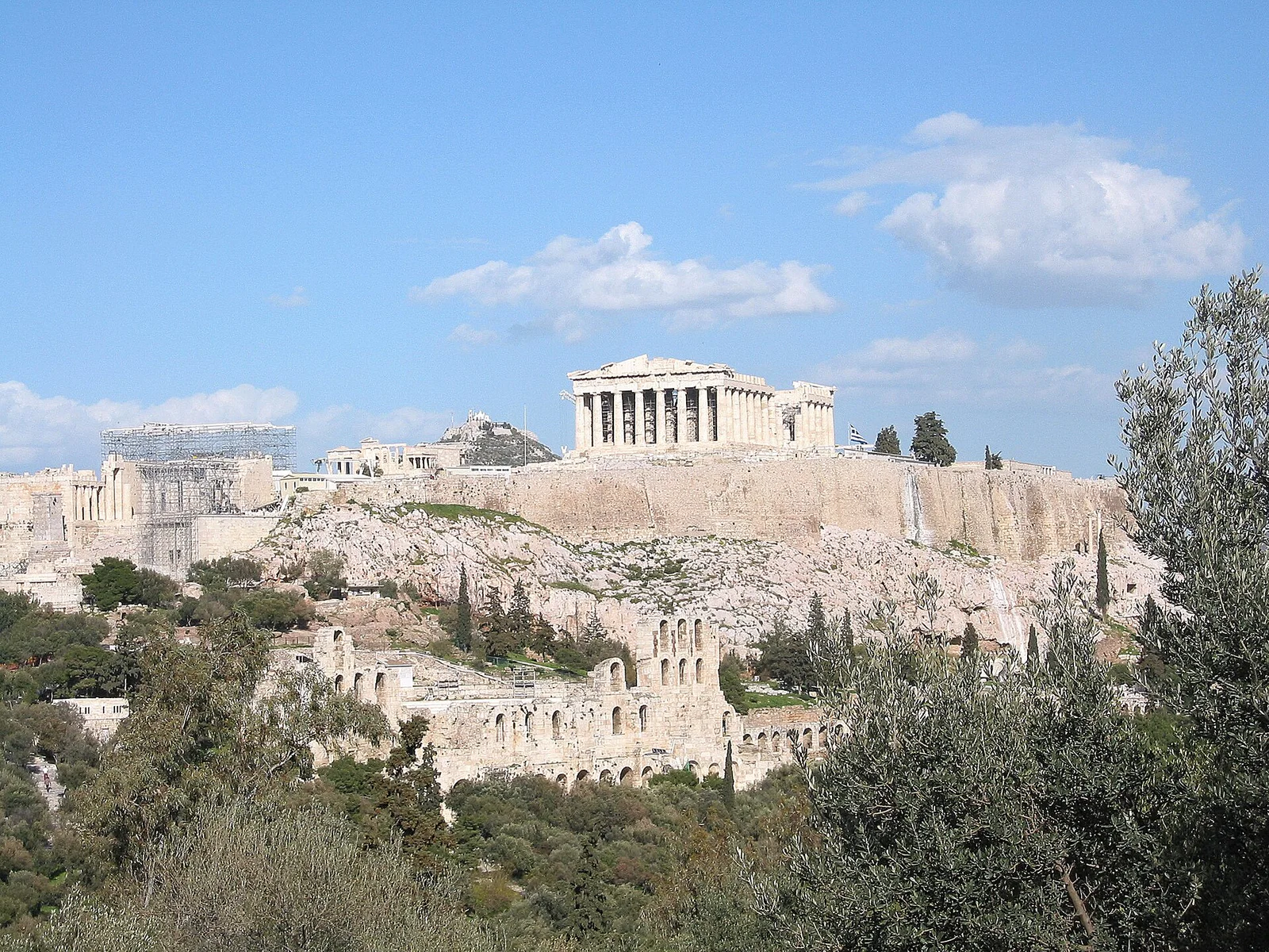 The Acropolis of Athens rising above the modern city, with the Parthenon and surrounding classical sanctuaries crowning the limestone plateau
