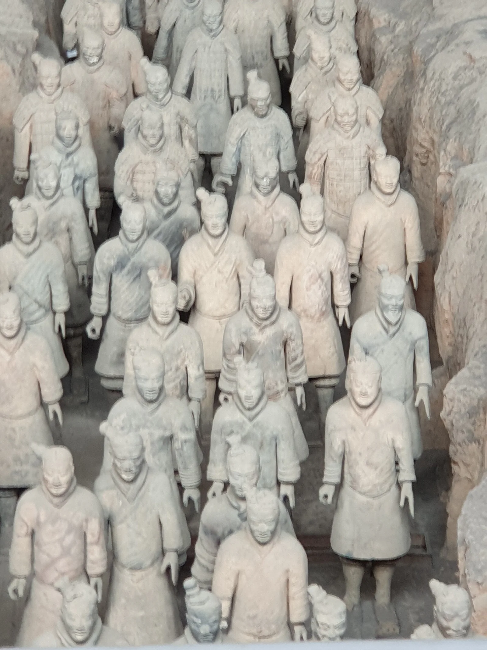 Ranks of life-size terracotta warriors displayed in the excavation hall of Pit 1.